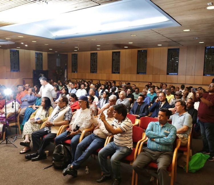 The audience watched the documentary with deep interest and admiration.